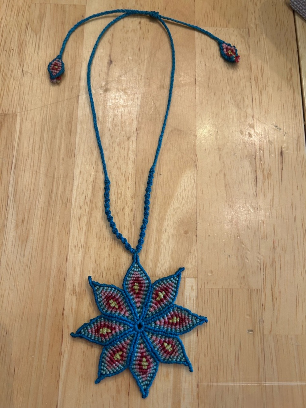 Handmade Rich Blue Macrame Flower Necklace with Red and Yellow Accents - Picture 3 of 6